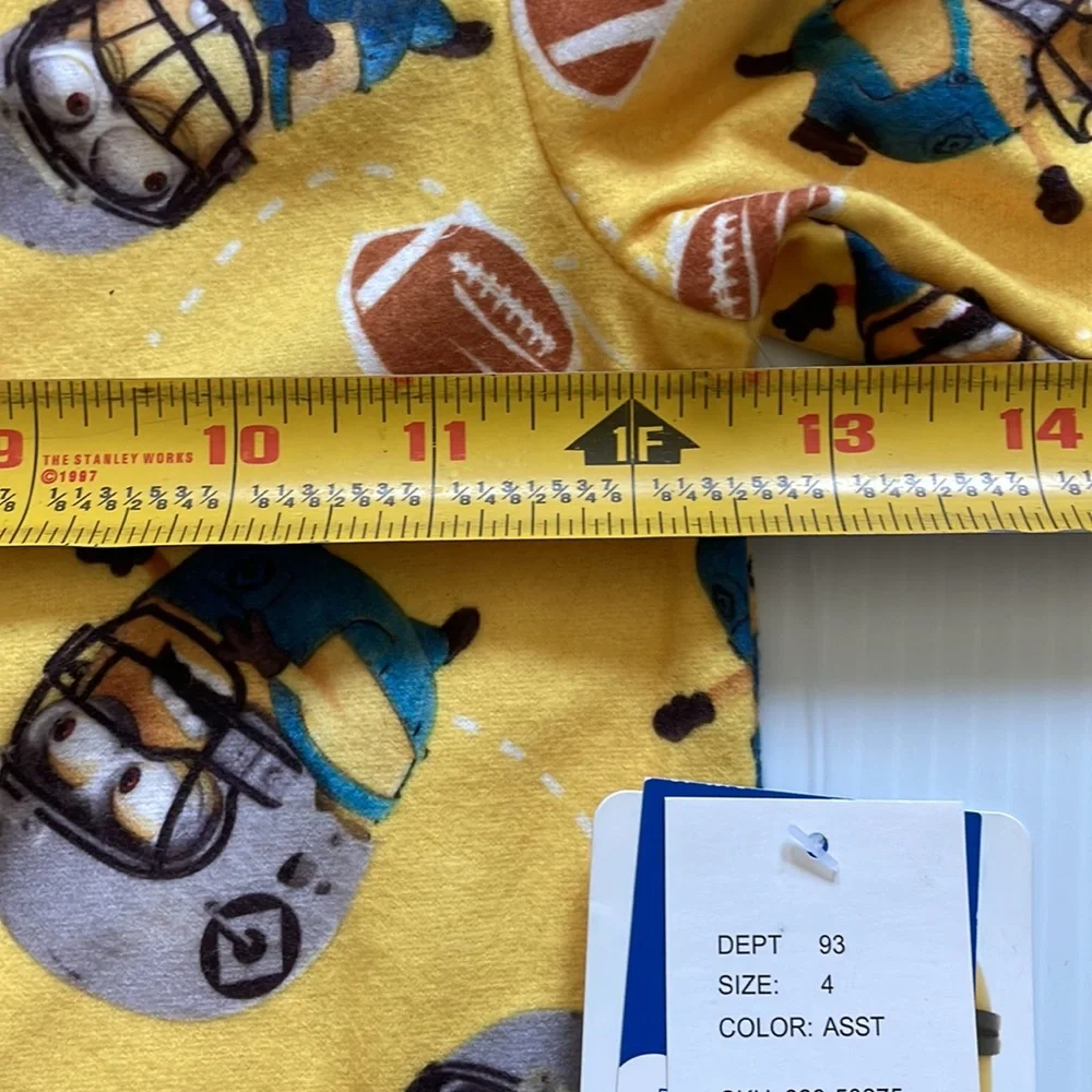 Minions yellow football pajama top & bottoms.  Size 4